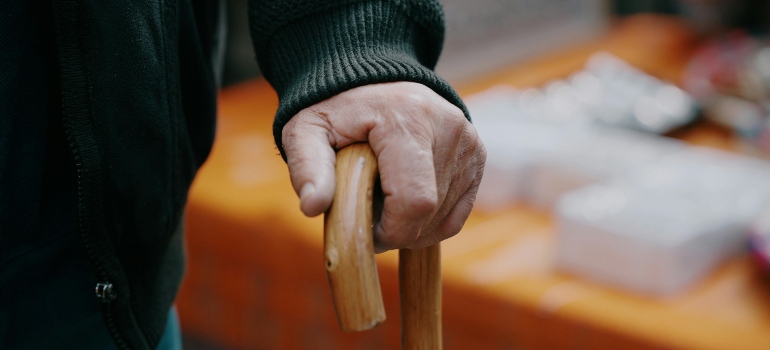 A senior using a cane.