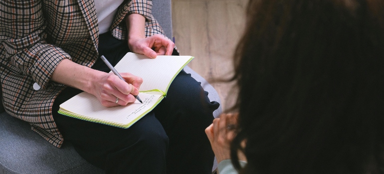 A person speaking with a counselor.